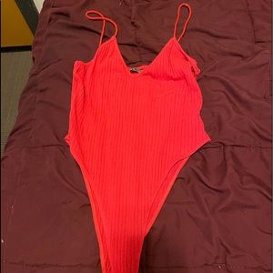 Women’s red bodysuit